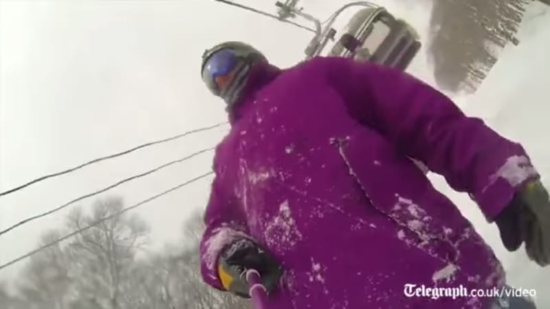 selfie stick snowboarder